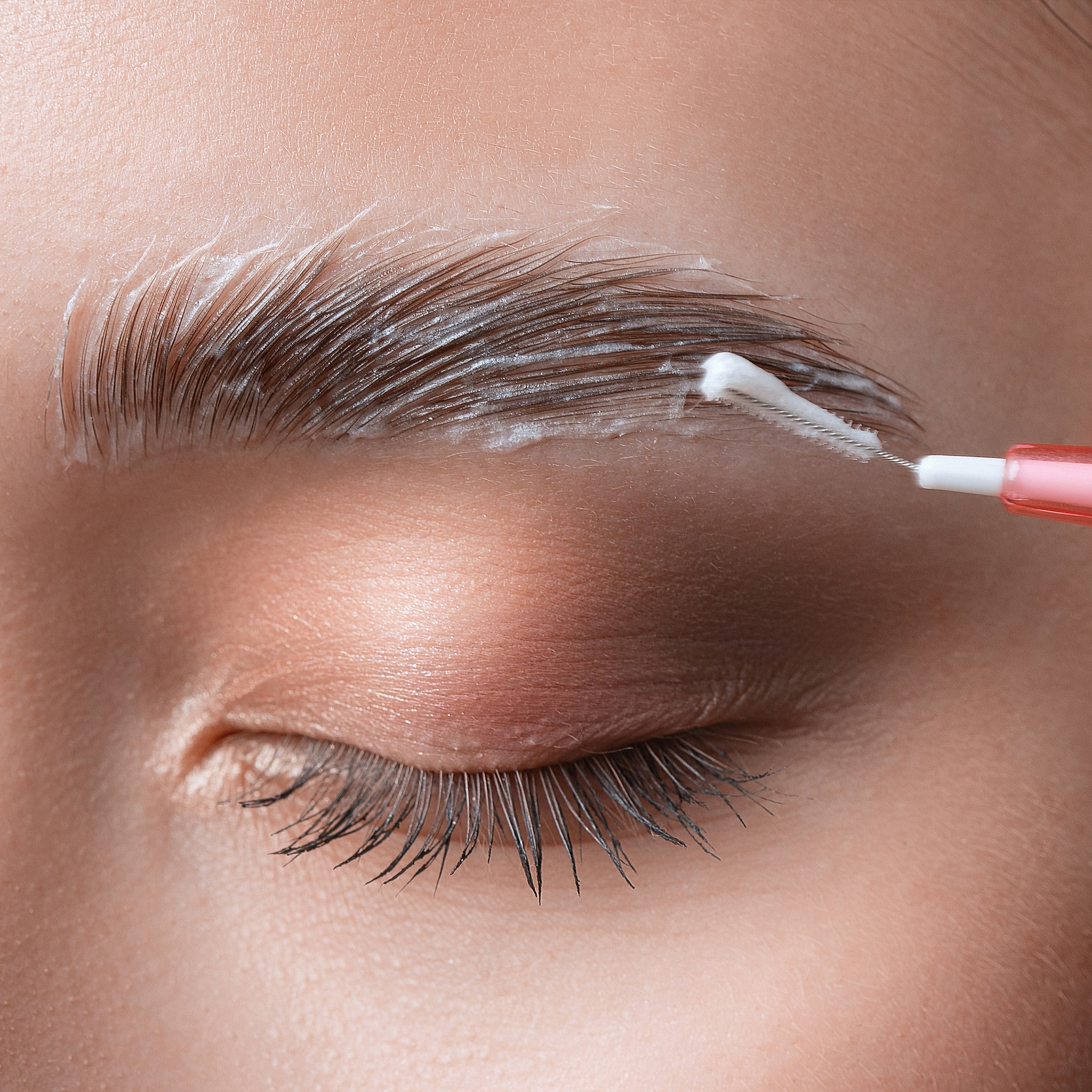 combined Image brow lamination and lash lift with product and brush.