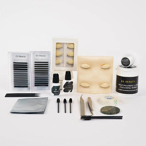 Lash products with wipes, brushes, false eyes on a white backdrop. 