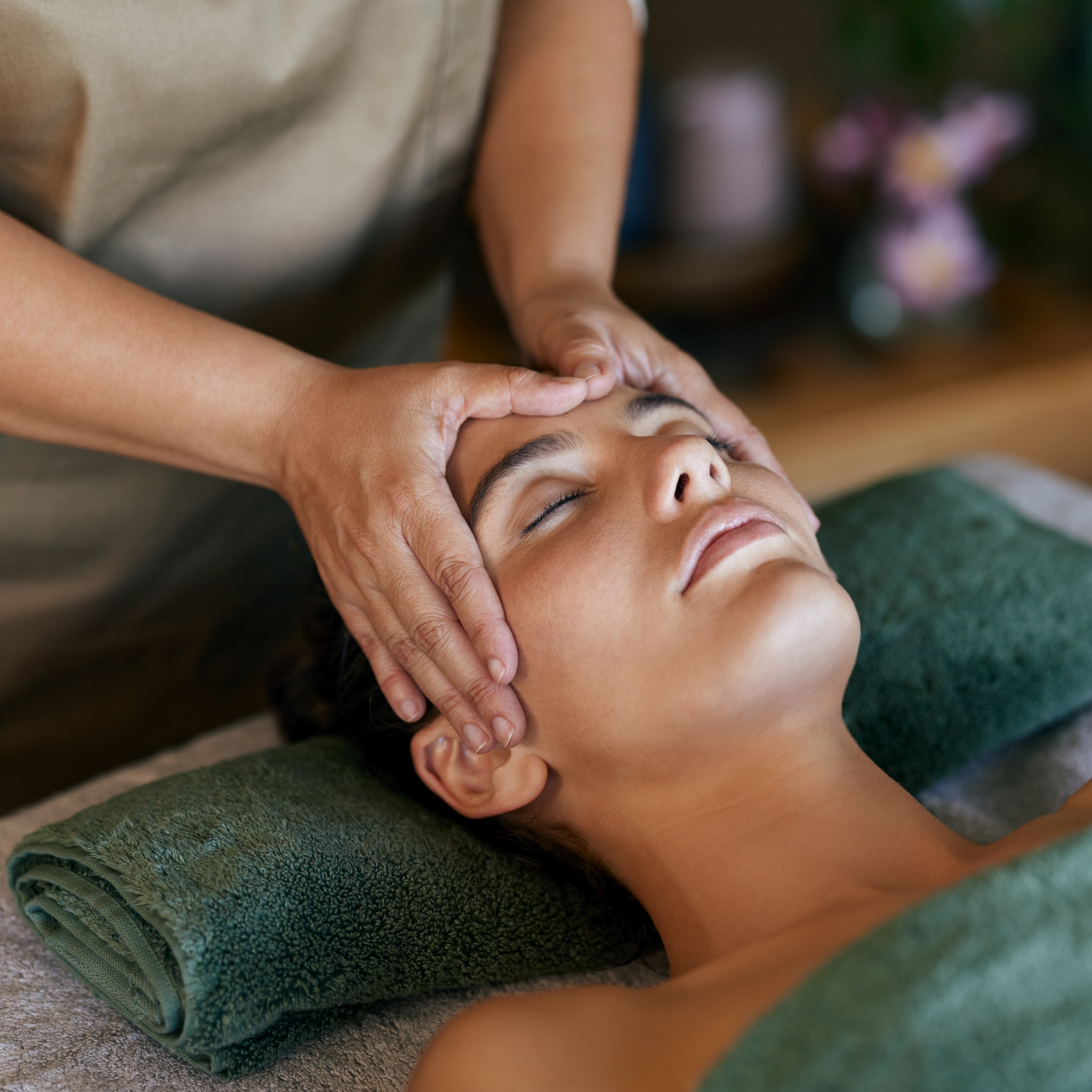 Person receiving an Indian head massage in a spa setting